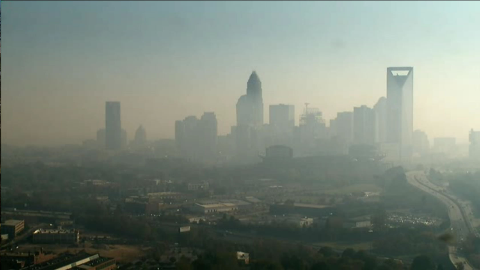 Image of Charlotte, North Carolina in November 2016 after smoke was transported from fires on the eastern NC Appalachian mountains.  Air Quality Index was red for a day, which is really rare.  Photo is from WBTV tower cam.